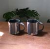 Slab-built porcelain mug with black and other colors. | Drinkware by Renee's Ceramics. Item made of ceramic