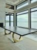 Charcoal walnut brass halo dining table | Tables by YJ Interiors. Item made of walnut with brass works with mid century modern & contemporary style