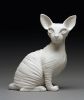 Hand Sculpted porcelain Sphinx kitten | Ornament in Decorative Objects by Bethany Krull. Item made of ceramic
