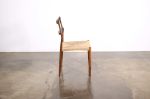 Carved Wood Dining Chair with Woven Rush Seat by Costantini | Chairs by Costantini Design. Item composed of oak wood