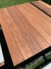 Kevin Hart's Black 8-Seater SwingTable Teak | Picnic Table in Tables by SwingTables | Kevin Hart's Home in Calabasas. Item composed of wood and steel