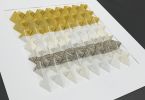 Pair of folded paper sculptures - yellow stripes | Mixed Media by Studio NEA Design. Item made of paper