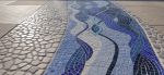 Mosaic patio inlay suggesting a river | Public Mosaics by JK Mosaic, LLC. Item made of stone