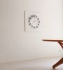 ""Mocap WHITE/BLACK" illusionistic wall clock" | Decorative Objects by JAN PAUL. Item made of wood & metal compatible with mid century modern and contemporary style