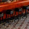 Round Backless Bar Stools - Model 2525 | Chairs by Richardson Seating Corporation | The GMan Tavern in Chicago. Item composed of brass