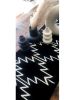 Cleo Handwoven Wool Table Runner – Black & White Zigzag | Linens & Bedding by Mumo Toronto. Item made of cotton with fiber works with boho & country & farmhouse style