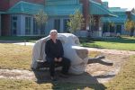 Swimming Retriever | Public Sculptures by Jim Sardonis. Item made of bronze & stone