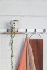 Coatrack by the meter, 3D laser cut metal tube with wardrobe hooks. Customizable till 6 meters. | Hardware by Maarten Baptist. Item composed of metal