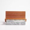 Magazine Holder | Book Case in Storage by Boom Bechkowiak. Item composed of wood and cement in contemporary or modern style