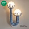 Baby Blue Sculptured Sconces with Glass bubbles | Sconces by Light and Fiber. Item made of steel with glass works with mid century modern & contemporary style