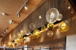 Bubble | Chandeliers by Illuminata Art Glass Design by Julie Conway | Din Tai Fung in Bellevue. Item made of brass & glass