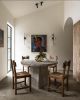 Silver Travertine Round Pedestal Dining Table | Tables by Phidias Atelier. Item made of marble