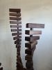 Stacks Series: Walnut Helices | Sculptures by Where Wood Meets Steel. Item made of walnut with steel works with modern style