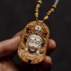 Carved Sandalwood & Deer Horn Deity Amulet Art | Ornament in Decorative Objects by Dynasty Artisan. Item made of wood works with contemporary & eclectic & maximalism style