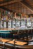 Collector’s Marigold Overhead Bar Shelving | Storage by Amuneal | Keswick Hall in Keswick. Item made of metal & glass