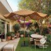 A large natural-fiber patio umbrella with a black base stan | Ornament in Decorative Objects by GoldencoirVietNam LLC. Item made of wood with fiber works with boho & country & farmhouse style