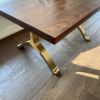 Black walnut dining table with brass wishbone legs | Tables by YJ Interiors. Item made of walnut with brass works with mid century modern & contemporary style