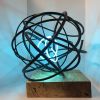 Neon Orb I | Public Sculptures by Mark Beattie MRSS | Park Plaza London Waterloo in London. Item made of wood with copper