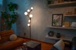 Chaparral | Floor Lamp in Lamps by Oehl. Item composed of oak wood & glass compatible with minimalism and mid century modern style