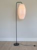 Gold floor lamp with a pleated oval long lampshade | Lamps by Studio Pleat. Item made of aluminum with paper works with minimalism & contemporary style