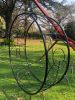 Studio Stirling Ndebele Wheel | Swing Chair in Chairs by Studio Stirling. Item composed of brass compatible with minimalism and modern style