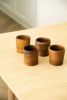 Handcarved Wooden Coffee Cup | Drinkware by Creating Comfort Lab. Item made of walnut