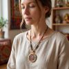 Tibetan Yellow Jambhala Thangka Wealth Amulet Pendant | Ornament in Decorative Objects by Dynasty Artisan. Item composed of metal in contemporary or eclectic & maximalism style