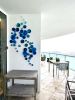 Blue cascade of circular epoxy resin sculpturar element | Mixed Media by Wall Art Object by Betti Brillembourg