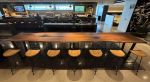 16' solid walnut slab table | Communal Table in Tables by Where Wood Meets Steel | United Club in Denver. Item made of walnut with steel works with modern & traditional style