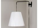 Industrial sconce with pleated empire lampshade | Sconces by Studio Pleat. Item made of metal with paper works with mid century modern & contemporary style