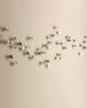 Titled "The Softness," porcelain ceramic petal sculpture | Wall Sculpture in Wall Hangings by Elizabeth Prince Ceramics. Item composed of metal and ceramic in contemporary or japandi style