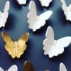 Set of 11 Gold & White Porcelain Ceramic Butterflies | Wall Sculpture in Wall Hangings by Elizabeth Prince Ceramics. Item composed of stoneware in minimalism or contemporary style